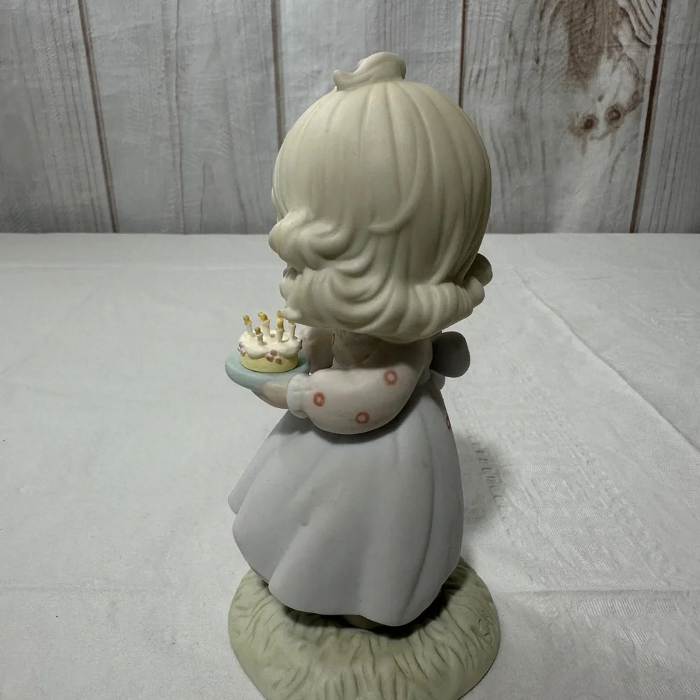 Precious Moment’s figurine titled “May Your Birthday Be A Blessing” from 1990
